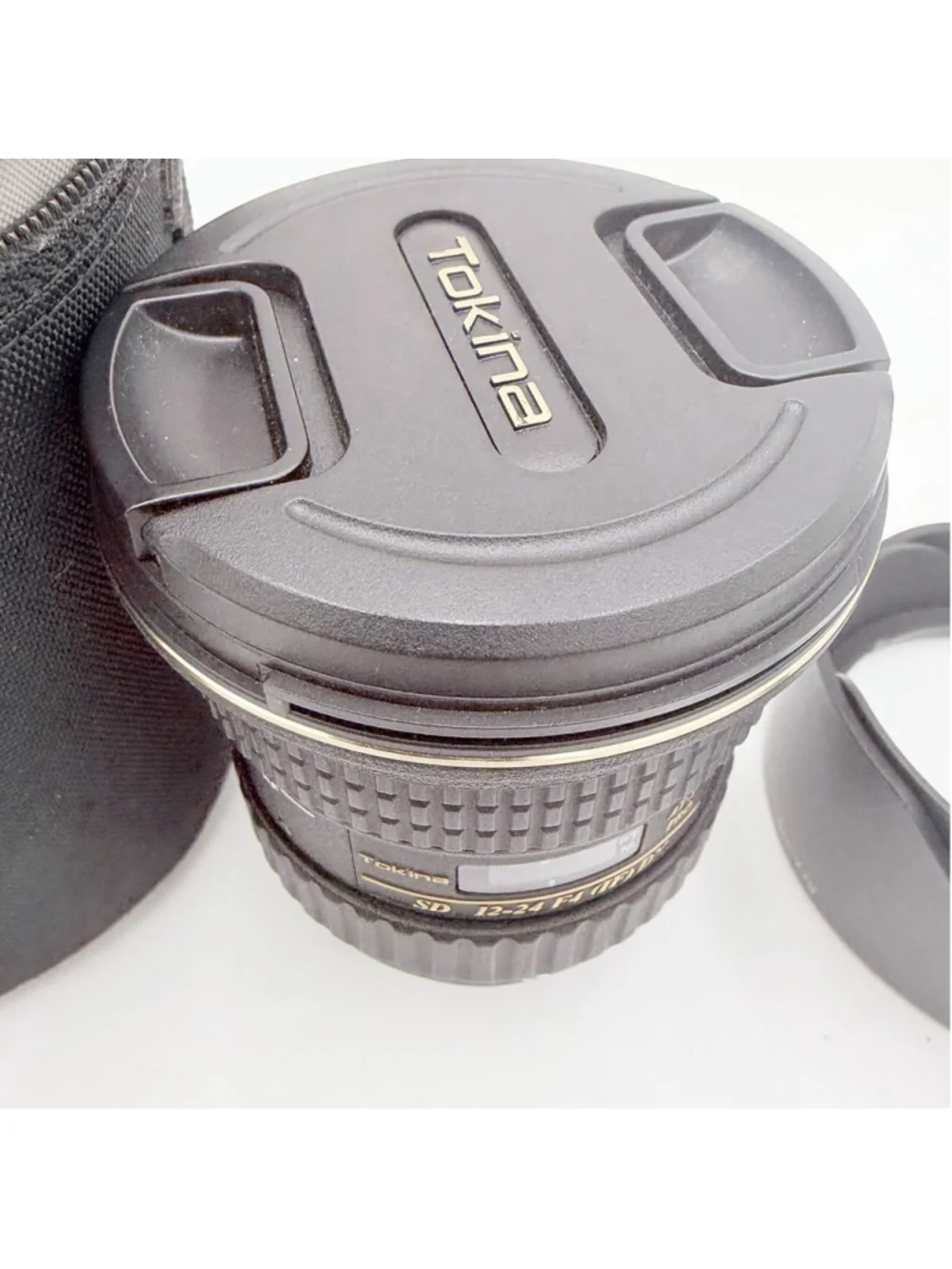 Nikon questions cosmetic cap